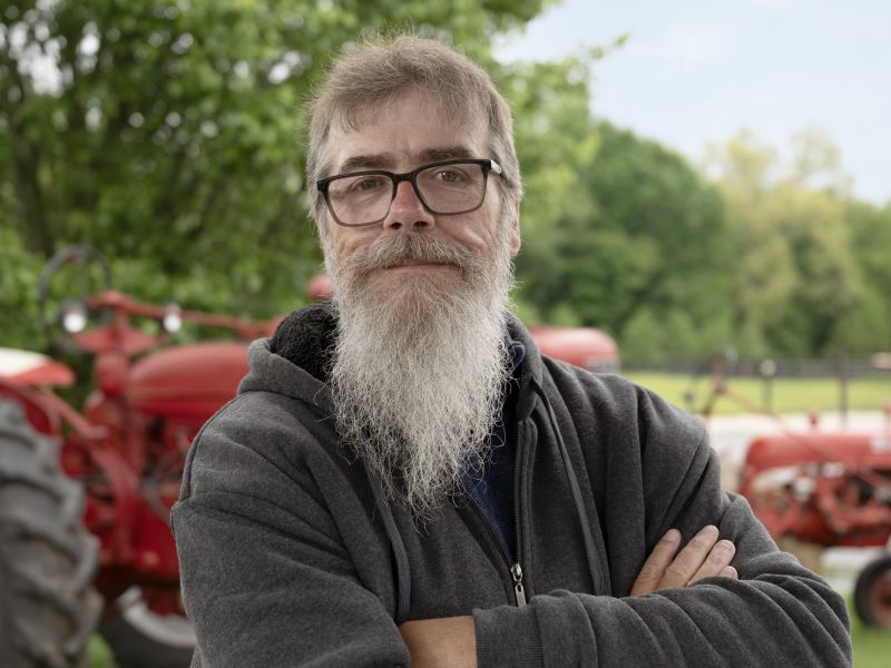 Kevin in front of tractor