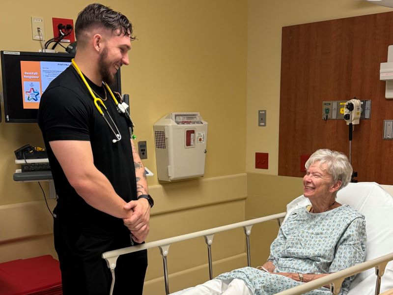Male nurse talking to patient