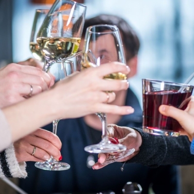group of people toasting drinks