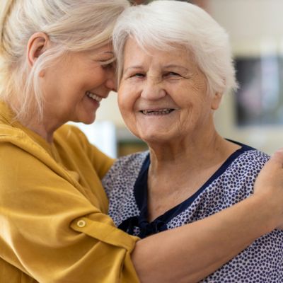 Women hugging and smiling
