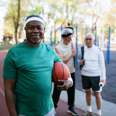 Older black man with a basketball