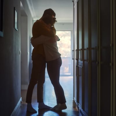 Couple hugging in darkness