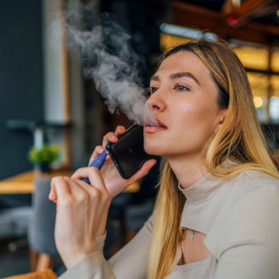 Blond woman vaping