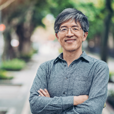 Portrait of a middle aged Chinese ethnicity man in a park