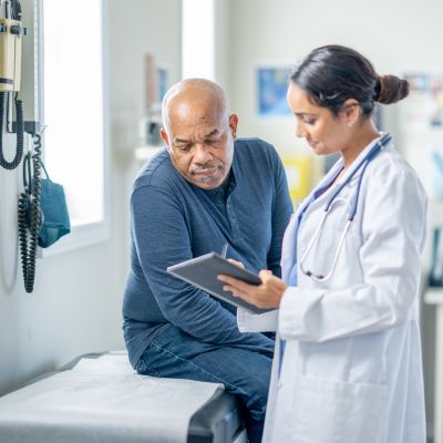 A doctor explaining medical information to her patient
