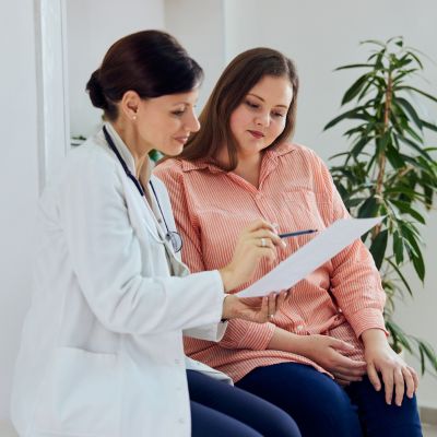 A doctor explaining a patient's chart to her