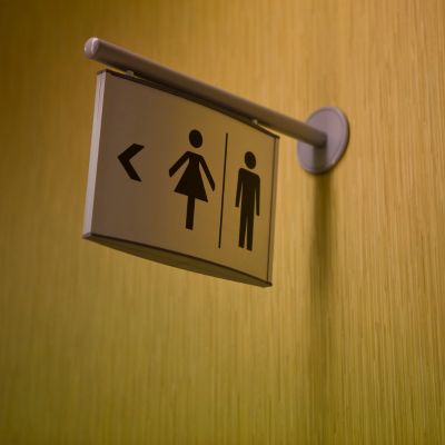 A sign pointing to public restrooms