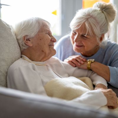 Two older women talking to each other