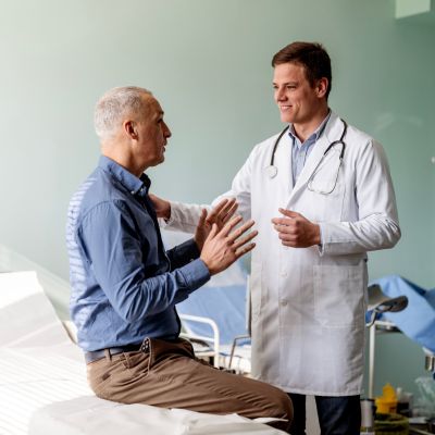 A middle aged man consulting with his doctor