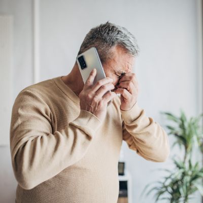 An anxious man on the phone