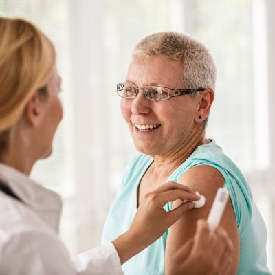 A woman getting her flu shot
