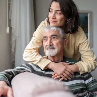 Lady hugging older man