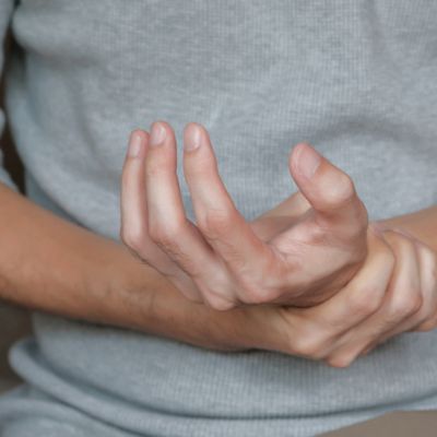 man with pain in his hand