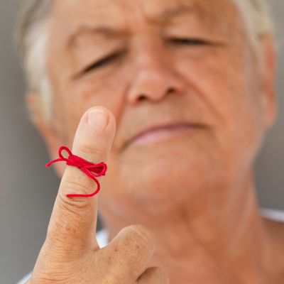 man with reminder knot on finger