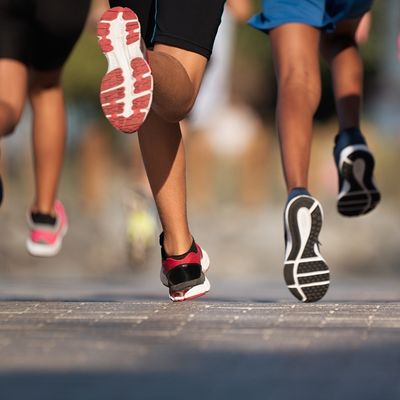 people with shoes running on road
