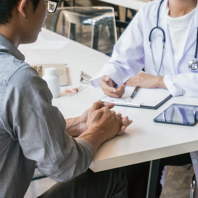 Man talking to doctor