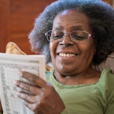 Older woman working on sudoku puzzle
