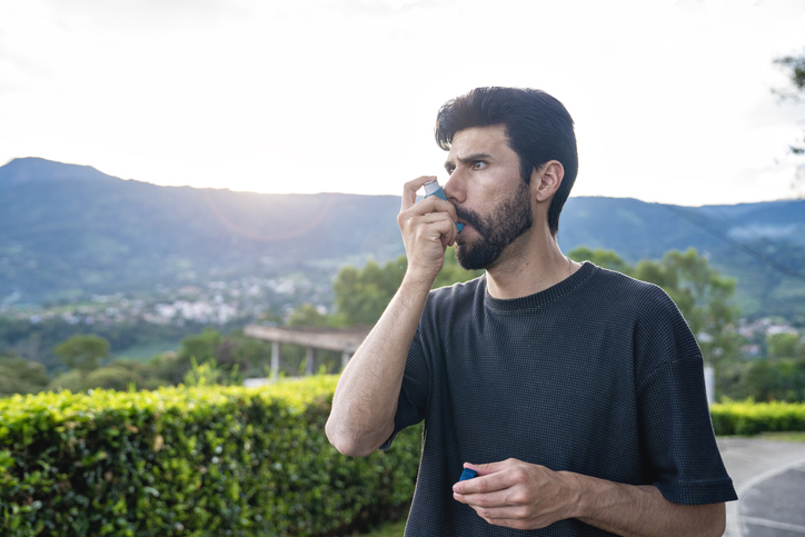 Man using inhaler 