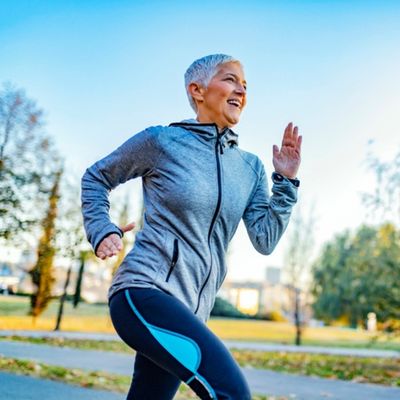 A woman runs outside.