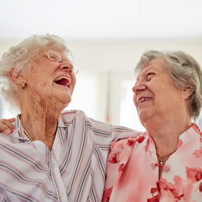 Two older woman laughing