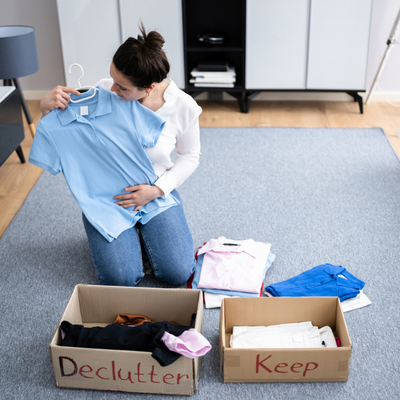 Woman sorting clothes into boxes