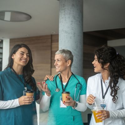 female nurses and doctor talking