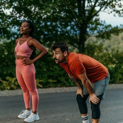 Woman and tired man running