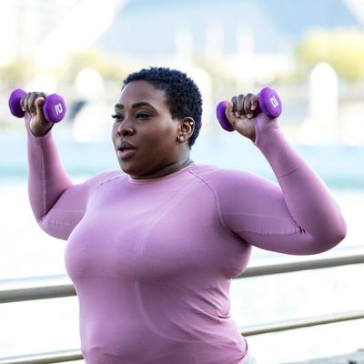 Woman lifting weights outside