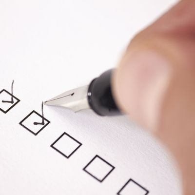 Person checking off item on list