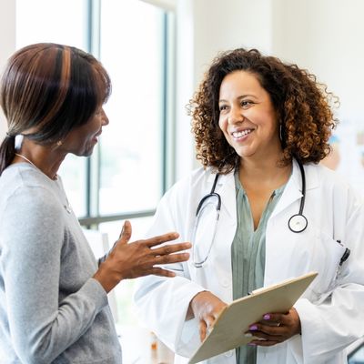 Doctor and patient reviewing medical chart