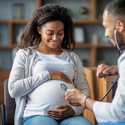 Pregnant woman with doctor