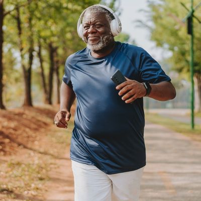 Older man running with headphones on