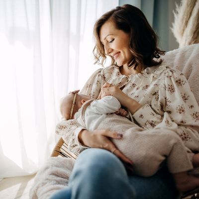 Woman breastfeeding infant