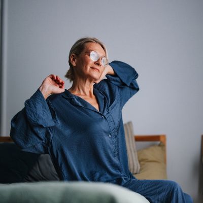 Woman stretching in bed