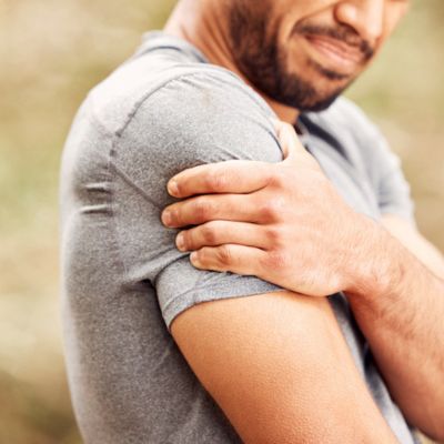 Man holding his shoulder in pain