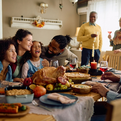 Family Eating Dinner and Laughing