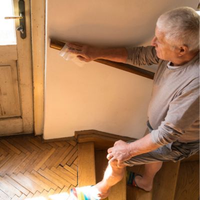 Senior man walking up stairs