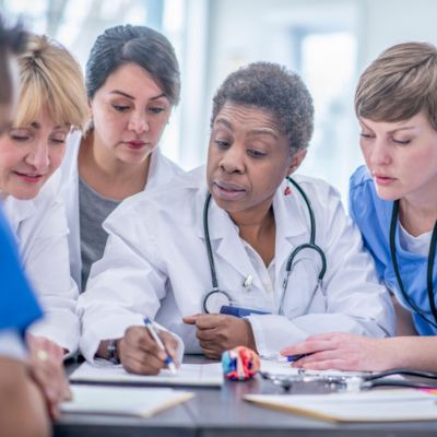 Nurses looking at paperwork
