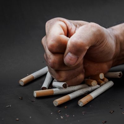 Fist smashing cigarettes