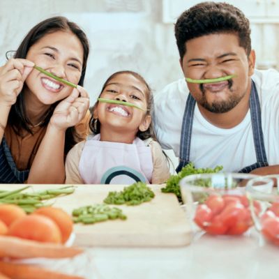 Family having fun with veggies