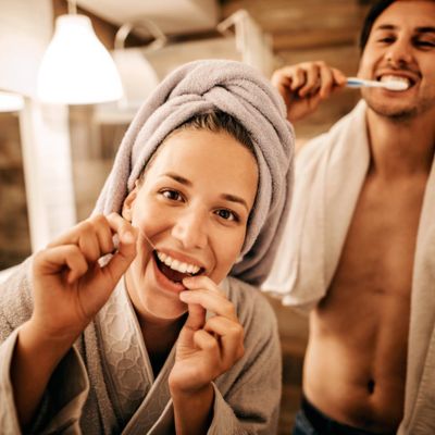 Couple brushing their teeth