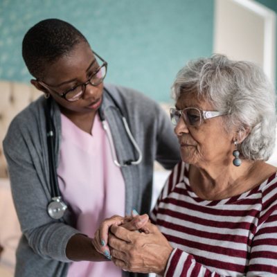 Older lady with caregiver