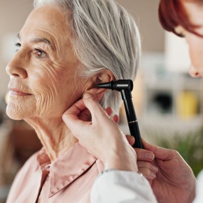 Older woman getting her hearing checked