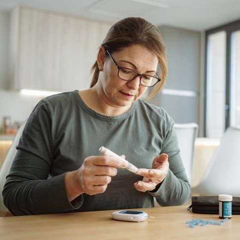 Woman checking her sugar levels