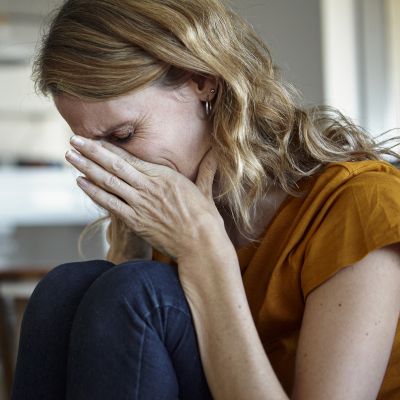 Woman stressed with praying hands