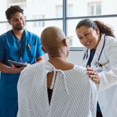 Cancer patient is talking with clinical staff
