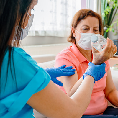 Woman lifting a water bottle 