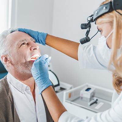 Dentist looking at a patient