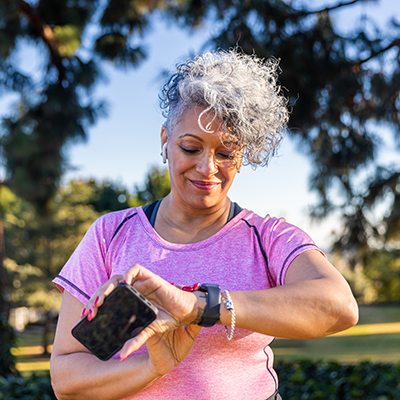 women checking smart watch