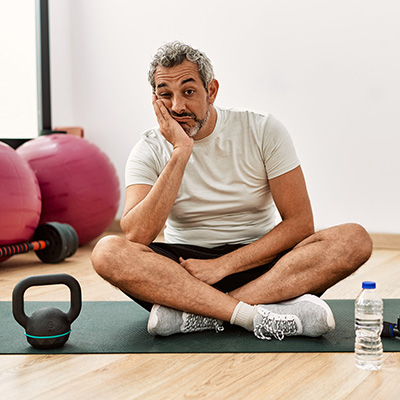 man working out looking tired